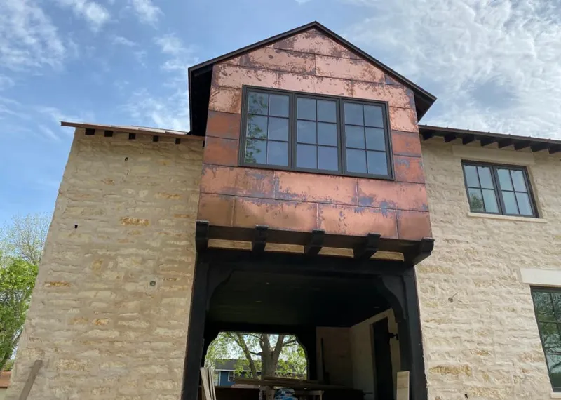 Copper metal panel facade on a stone building for Metal Roof Coating in Mattoon